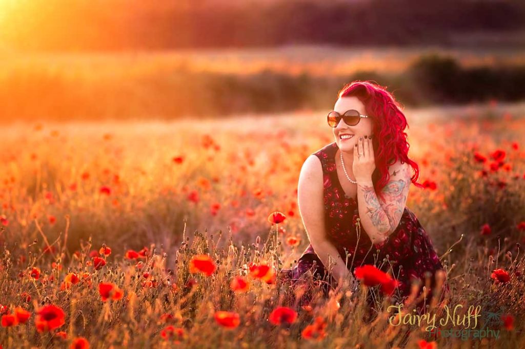 Lady in a field of poppies at sunset during a family photography session in NOttingham, UK