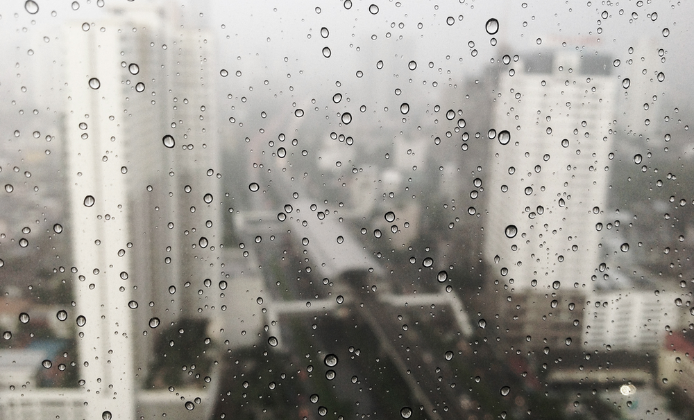 Rainy windows overlooking a city scape