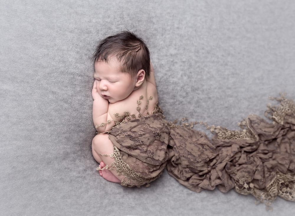 Aerial shot of baby in tushie up pose