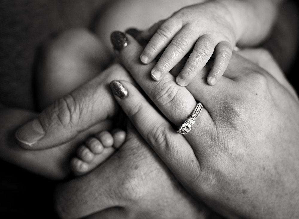 Engagement ring and baby detail image