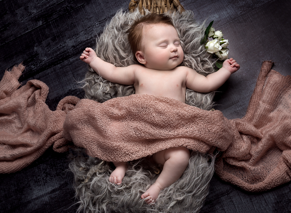 16 week old baby girl, asleep in a basket prop with wraps - Baby Photoshoot at Fairy Nuff Photography Nottingham
