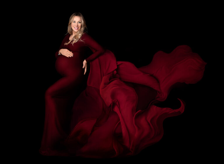 Dramatic flowing fabric on a designer pregnancy dress at a studio maternity photo session at Fairy Nuff Photography, Nottingham