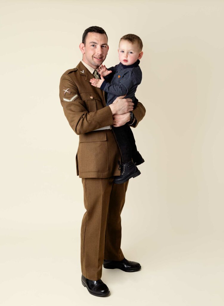 Dad in British Army uniform holding his Son at a family photoshoot at Fairy Nuff Photography, Nottingham